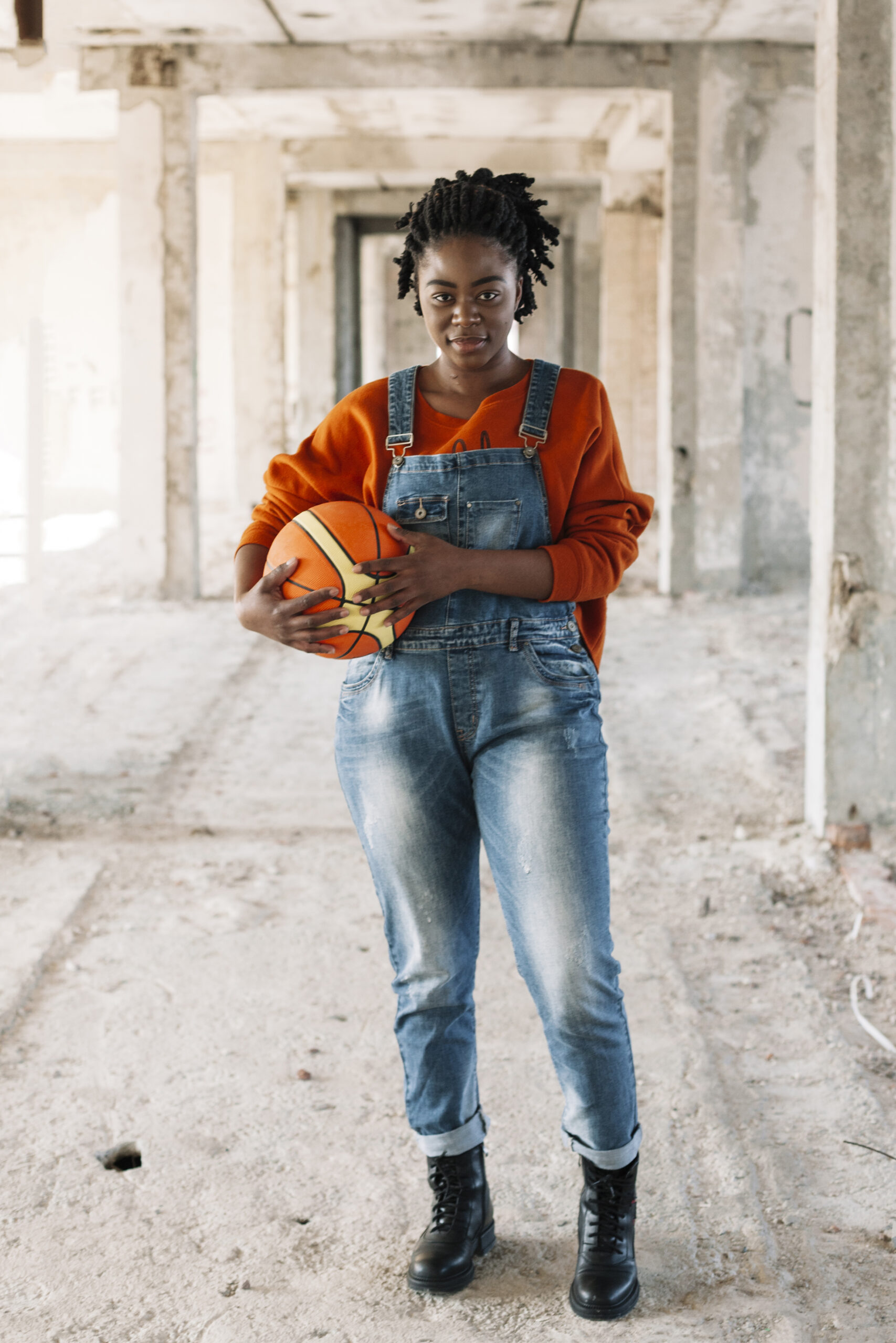 portrait-teenager-posing-with-basketball-ball